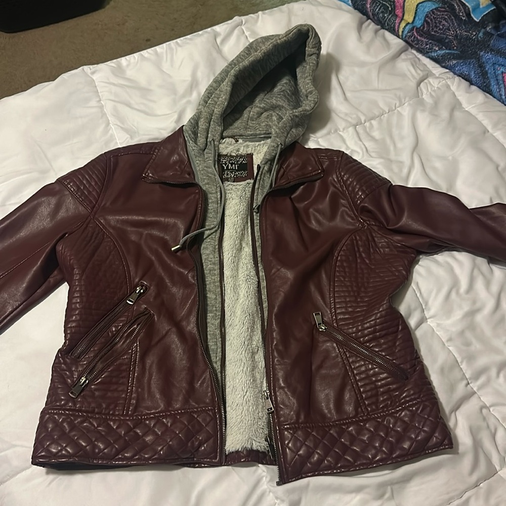 Faux leather jacket. Marroon color. Detachable hood. Two functional pockets.